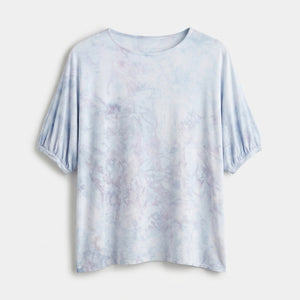 Light blue tie-dye t-shirt on a white background